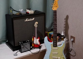 a guitar and amp sitting on a table