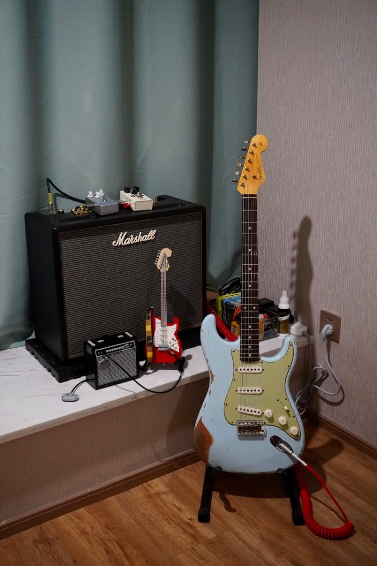 a guitar and amp sitting on a table