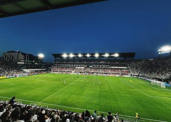A soccer stadium filled with lots of people