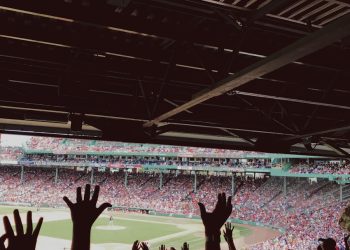 people watching baseball game during daytime
