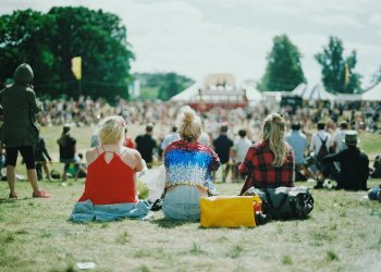 group of people on grass field under sunny day