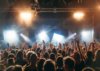 people watching band performing on stage